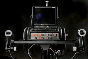A vintage electronic device with a small screen and multiple buttons.